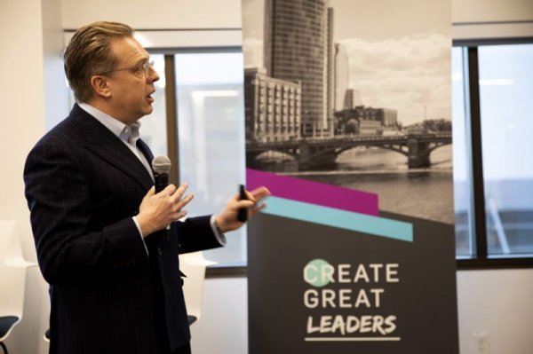 photo of a man speaking at a public event